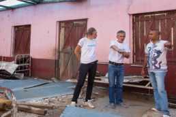 Factfinding tour of the Bezaha team: Silke Schopf, left, nurse and Andreas Zuckerlas, center, organizer, architect and technician) talking to Dr. Gaston (right) in the cyclone-damaged maternité, which belongs to the health station CSB 2 (Centre de Base 2) in Belamoty.