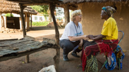 Pediatrician Dr. Judith Große Sudhues (left) talking with a hospital employee right in front of her hut